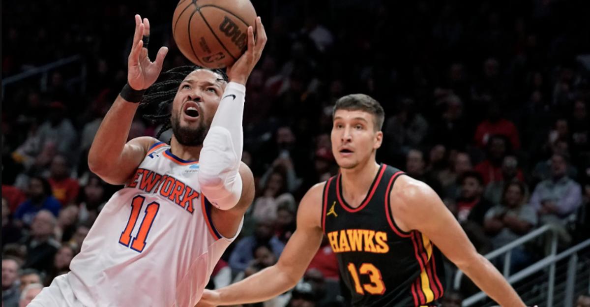 Jalen Brunson (11) did backcourt battle with Bogdan Bogdanović (13) on Wednesday in Atlanta